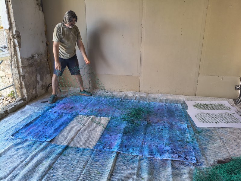 Alex Amengual working with fishermen’s nets in the studio, 2026
